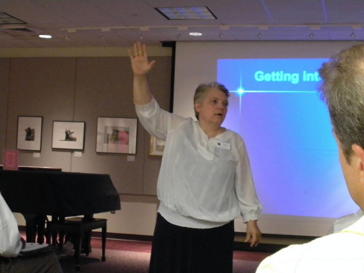 Marcia LaReau, a career coach for Bloomfield, Conn.-based Forward Motion LLC, conducts a session for job seekers at the Farmington Public Library.