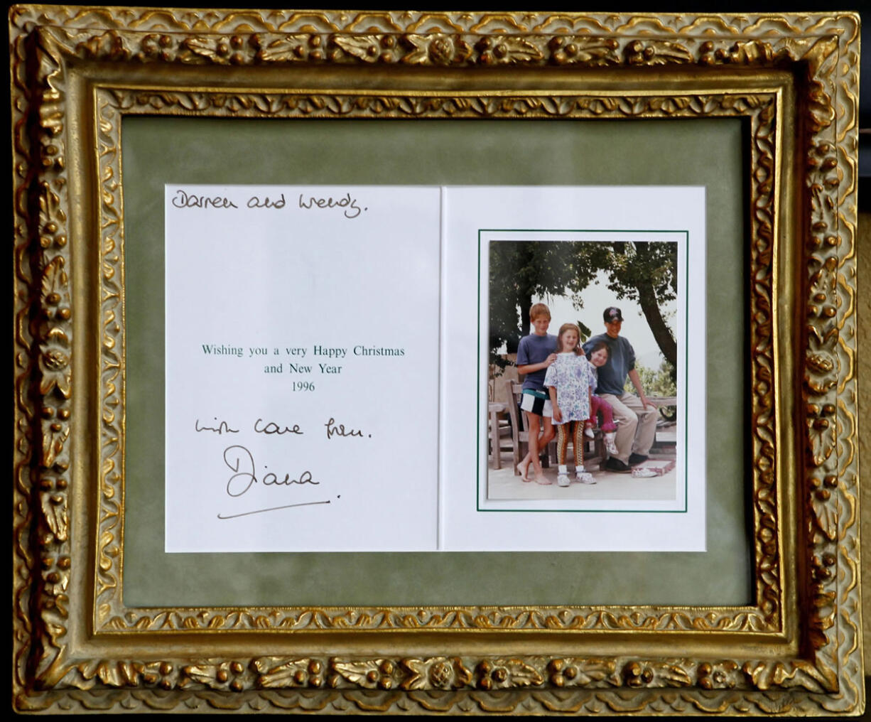 A Christmas card from the Royal children to Darren McGrady and his wife from Princess Diana in 1996 is shown. McGrady, who cooked at the palace for Prince William and Prince Harry when he was Princess Diana's personal chef, at his Plano, Texas, home, Wednesday, June 19, 2013.