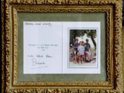 A Christmas card from the Royal children to Darren McGrady and his wife from Princess Diana in 1996 is shown. McGrady, who cooked at the palace for Prince William and Prince Harry when he was Princess Diana's personal chef, at his Plano, Texas, home, Wednesday, June 19, 2013.