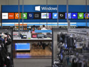 Customers browse the Windows Store inside the Best Buy in Richfield, Minn.