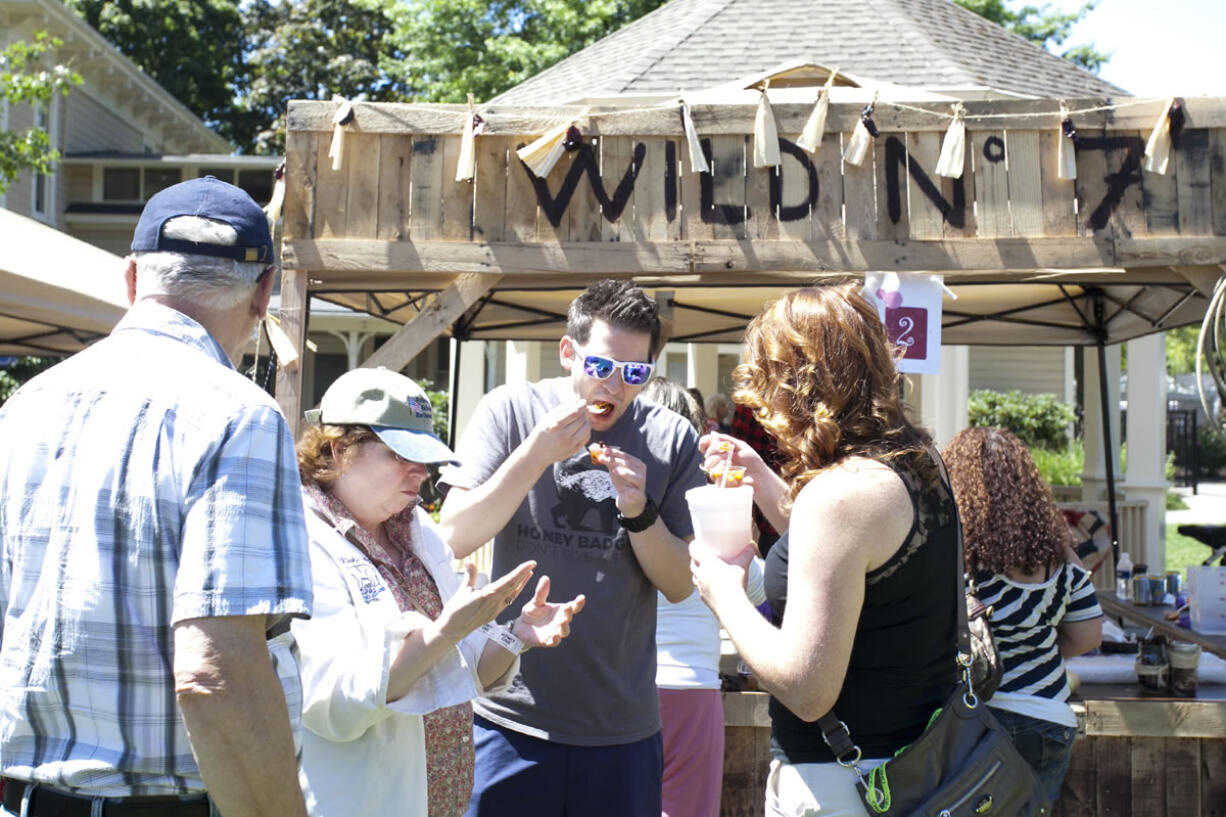 Mike Popravak tastes servings of chili for a tasting competition at Fire in The Park at Esther Short Park Saturday afternoon