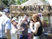 Mike Popravak tastes servings of chili for a tasting competition at Fire in The Park at Esther Short Park Saturday afternoon