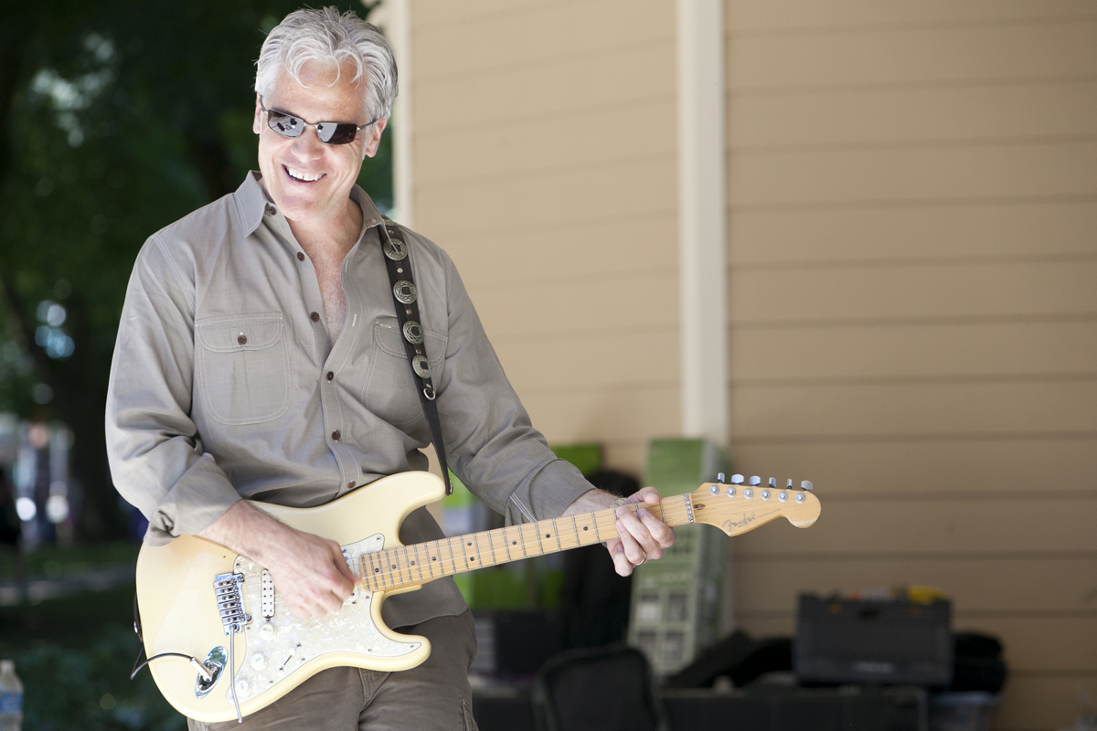 Yohn Baldwin plays guitar with High Point on Saturday afternoon at Esther Short Park.