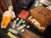 A mahjong set and doll from the 1920s are part of an exhibit, &quot;Project Mah Jongg,&quot; at the William Breman Jewish Heritage and Holocaust Museum in Atlanta that runs through Sept.