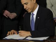 President Barack Obama signs the Affordable Care Act into law on March 23, 2010.