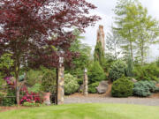 Rob Rosser
DJ and Roger Miles' gardens feature an impeccable collection of artwork and specimen plants.