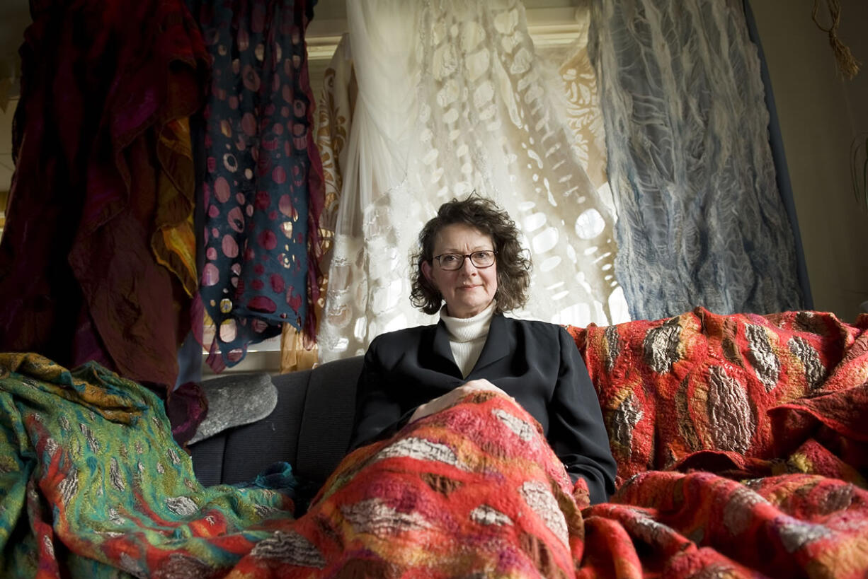 Janice Arnold, shown with some of her felt artwork in a 2009 photograph taken after her work was featured in an exhibition in New York City.