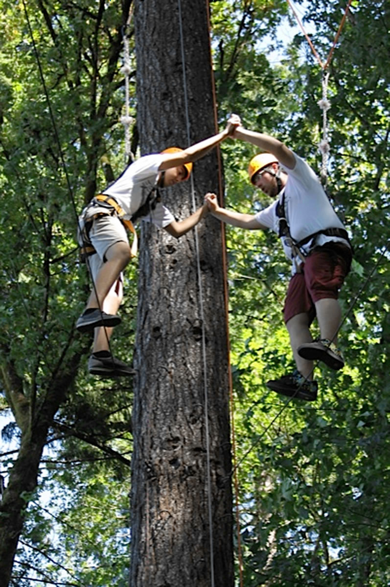 Kutlu Birinci, left, and Antonis Tilliros, both 17, do some high-altitude trust-building last month in an Oregon forest.