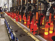 Bottles come off the production line red-hot and glowing at the Bennu Glass factory at the Port of Kalama.