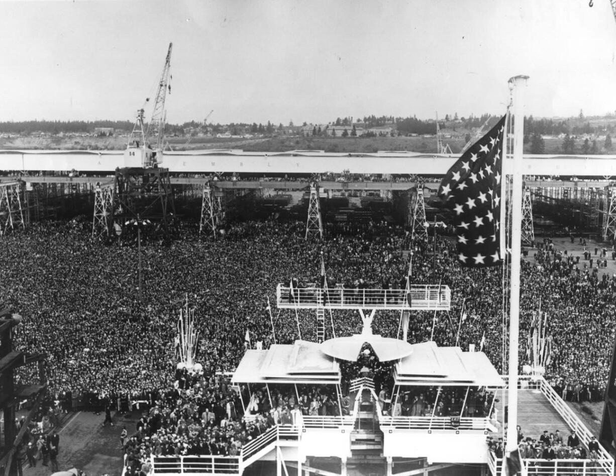 The greatest crowd in the history of Clark County, an estimated 75,000 shipyard workers, visiting dignitaries and local residents, crowded the Vancouver Shipyards on April 5, 1943, to cheer as first lady Eleanor Roosevelt christened the Alazon Bay, the first of 50 escort aircraft carriers to be built at the local yard.