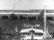 The greatest crowd in the history of Clark County, an estimated 75,000 shipyard workers, visiting dignitaries and local residents, crowded the Vancouver Shipyards on April 5, 1943, to cheer as first lady Eleanor Roosevelt christened the Alazon Bay, the first of 50 escort aircraft carriers to be built at the local yard.