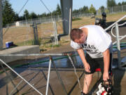 Jordan Downey lets the water drip down his face during a 98-degree day in Camas.