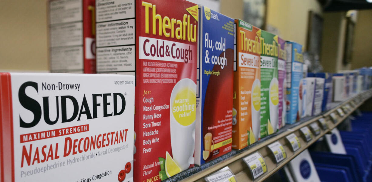 Boxes of cold medicines are seen behind a Portland pharmacy counter in 2005.