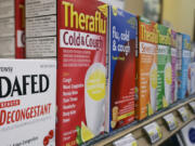 Boxes of cold medicines are seen behind a Portland pharmacy counter in 2005.