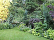 An enticing passageway draws the visitor in and leads them through the garden.