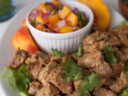 Renee Brock/Atlanta Journal-Constitution
Creating a taco bar at home is no longer the realm of ready-to-go kits with spice packets and jarred sauces. Making your own versions is the way to go with fillings such as this Pork al Pastor with Peach Salsa.