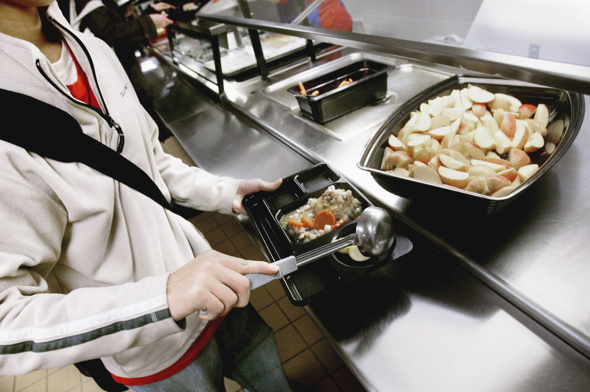 The new U.S. Department of Agriculture guidelines for school lunches require students to take at least one serving (1/2 cup) of fruits or vegetables.