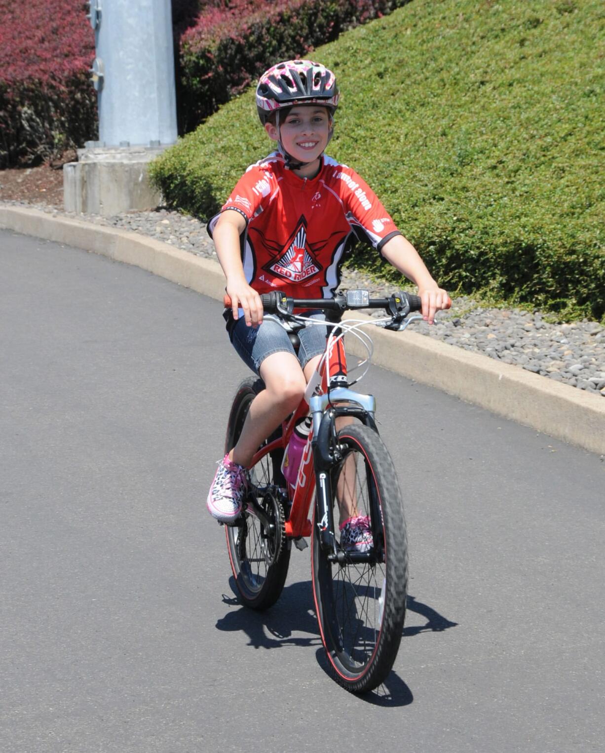 Contributed photo
Paige Maas, 9, is all smiles after completing the 26-mile course in the recent Tour de Cure event in Hillsboro, Ore. Her team, Paige's Pilots, raised more than $14,000 to help find a cure for diabetes.