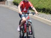 Contributed photo
Paige Maas, 9, is all smiles after completing the 26-mile course in the recent Tour de Cure event in Hillsboro, Ore. Her team, Paige's Pilots, raised more than $14,000 to help find a cure for diabetes.