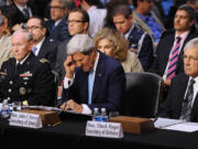 Chairman of the Joint Chief of Staff General Martin Dempsey, left, Secretary of State John Kerry, center, and Defense Secretary Chuck Hagel testify at the Senate Foreign Relations Committee on Tuesday to argue the Obama administration's case for using military force in Syria.