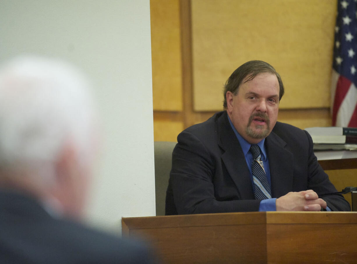 Washougal police Officer Robert Ritchie takes the witness stand during his assault trial March 14 in front of Clark County District Judge Sonya Langsdorf.