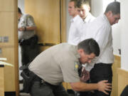 Mitchell Kangas, right, Jaren Koistinen, center, and Riley Munger, were sentenced on Oct. 4, 2011, for shooting cats in the Battle Ground area.