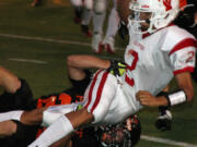 Bobby Jacobs traps the Fort Vancouver quarterback Friday, at Fishback Stadium.