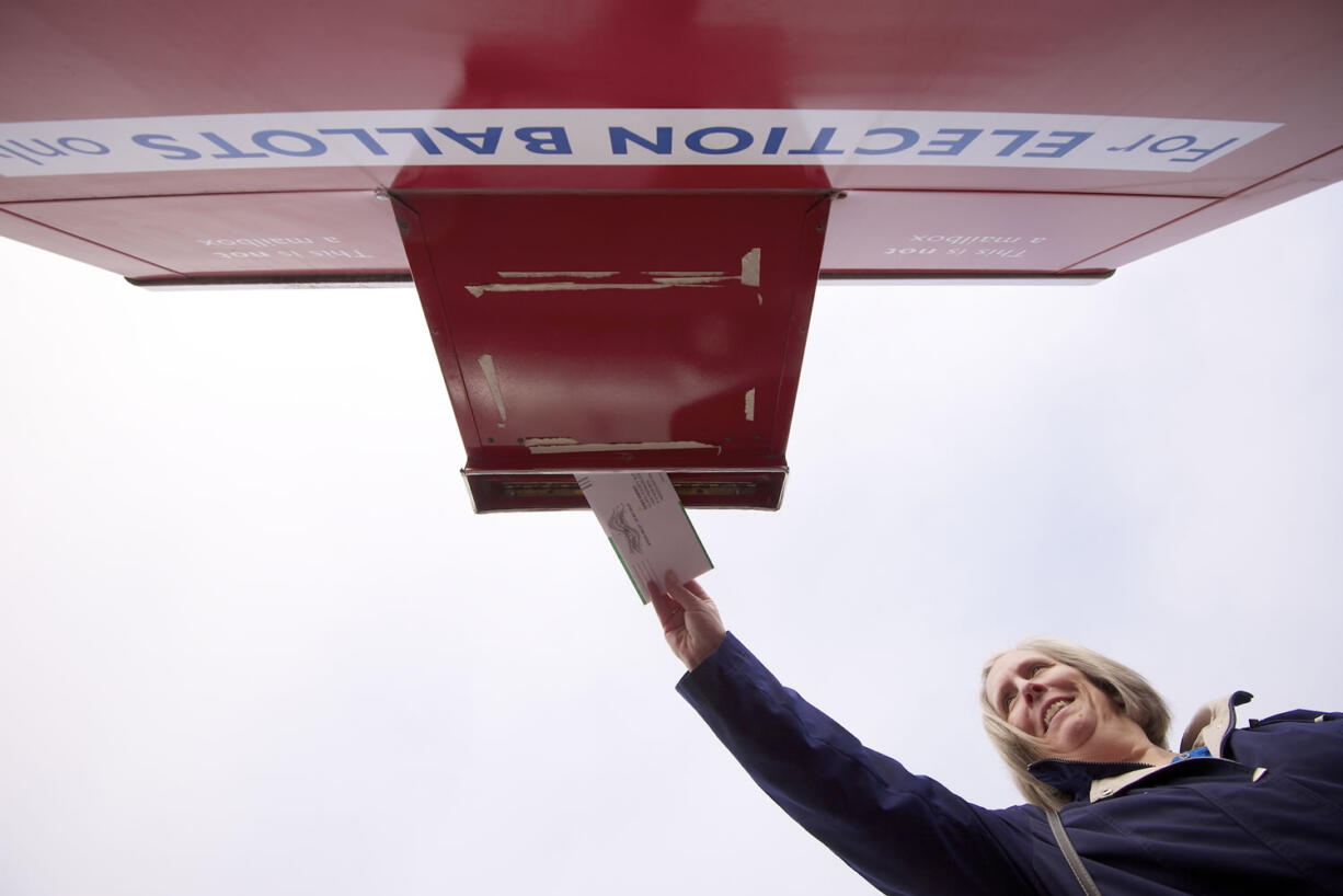 Columbian files
Sandy Wozny of Vancouver places her ballot in a ballot drop box Nov. 5, 2012, in Vancouver.