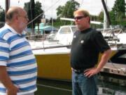 Mark Hamrick, Port of Camas-Washougal harbormaster (right) chats with Tom Welinski, of Camas (left), at the port marina. In August, Hamrick provided transportation and assistance when Welinski pulled a muscle in his back while sailboating. Hamrick said every day brings a new challenge. &quot;You never really know what's going to happen when you go to work or when you're not there for that matter,&quot; he said. &quot;Your phone can ring at any time for almost anything. It can get exciting at times, or go for days or weeks without an event.&quot; Hamrick was hired by the port in 2005, in the role of maintenance assistant.