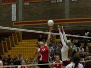 Camas middle blocker Carly Banks gets her fingertips on the volleyball.