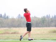 Braeden Campbell watches his tee shot sail over the wetlands that surround the Camas Meadows golf course.