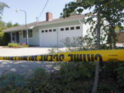 Crime scene tape frames an east Minnehaha home on Aug. 25 after an intruder was shot and killed.