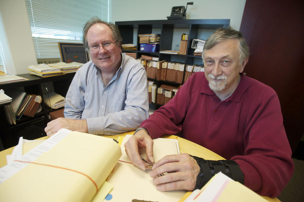 CPAs Mark Bacon, left, and John Caton say taxpayers can save time and money if they start now to prepare for next year's federal tax filing. The two men work at Day, Bacon, Smith &amp; Co.