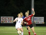 Camas junior Riley Allison (right) and a Columbia River Chieftain battle for the soccer ball Thursday, at Kiggins Bowl.