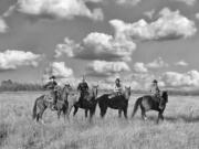 A photograph taken by Lara Blair features four women enrolled in an equine program in west Texas.