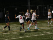 Anyssa DeVera runs up to hug Emily Ponce after the two Papermakers connected on the first goal of the game against Skyview Sept.