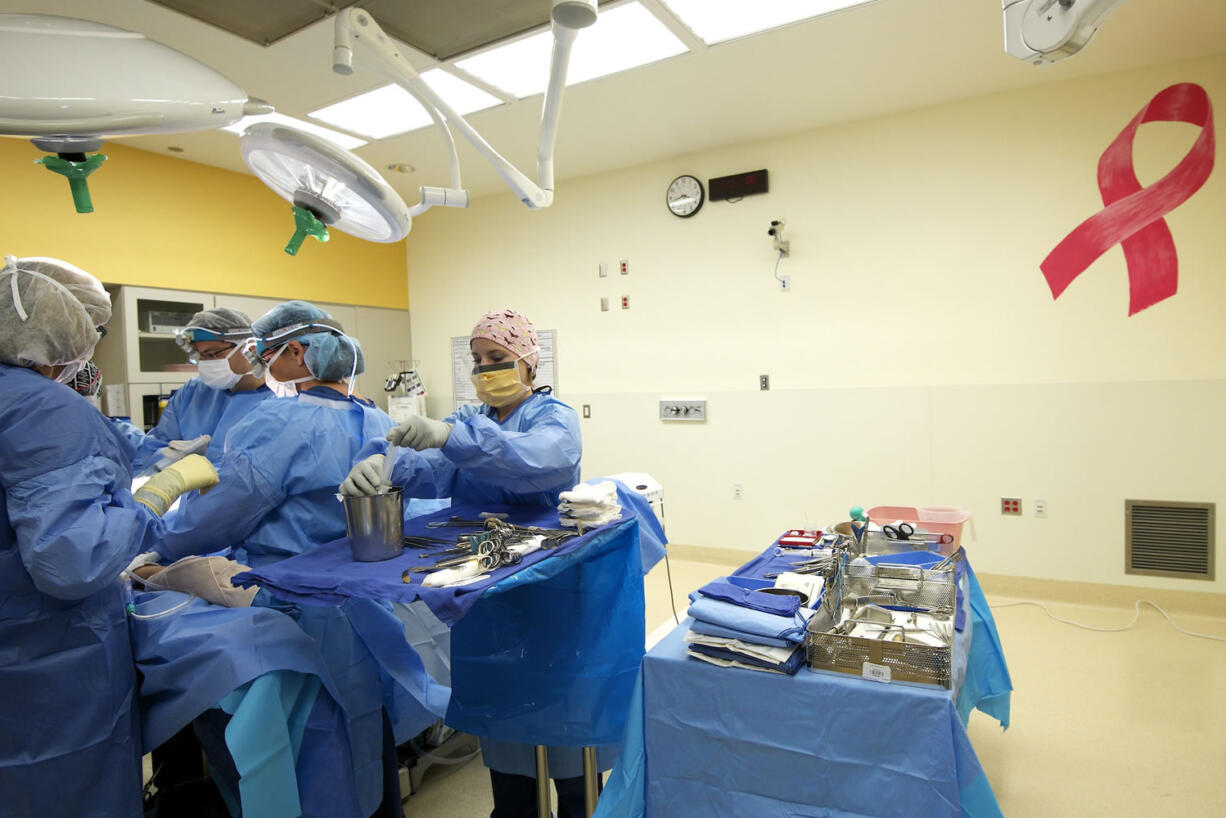 Dr. Toni Storm-Dickerson, second from right, and colleagues perform a bilateral nipple-sparing mastectomy at PeaceHealth Southwest Medical Center in Vancouver.