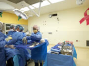 Dr. Toni Storm-Dickerson, second from right, and colleagues perform a bilateral nipple-sparing mastectomy at PeaceHealth Southwest Medical Center in Vancouver.