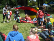 Children and parents enjoy some activities at last year's summer playground program.