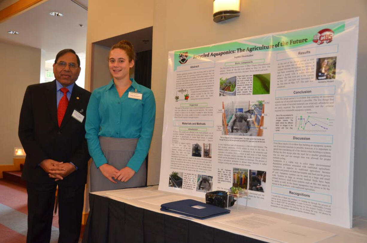 CHS sophomore Sophie Shoemaker poses for a photo with Subhash Singhald, president elect of the Washington State Academy of Sciences group.