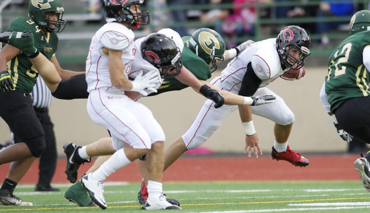 Camas linebacker Michael Digenova returns an interception against Evergreen at McKenzie Staduim, Friday, October 11, 2013.