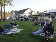 Spectators listen to Livin' Free at a Camas Meadows Golf Course concert at the conclusion of  the three-day weekend for veterans.