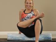 Sherri McMillan demonstrates the stretch foam roller.