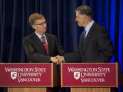 Rob McKenna, left, and Jay Inslee, candidates for governor of Washington, shake hands at the end of their debate Wednesday night at the Washington State University Vancouver campus.