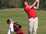 Camas freshman Brian Humphreys watches his chip shot take flight during the final round of the 4A district golf tournament Oct. 9, at the Tri-Mountain golf course.