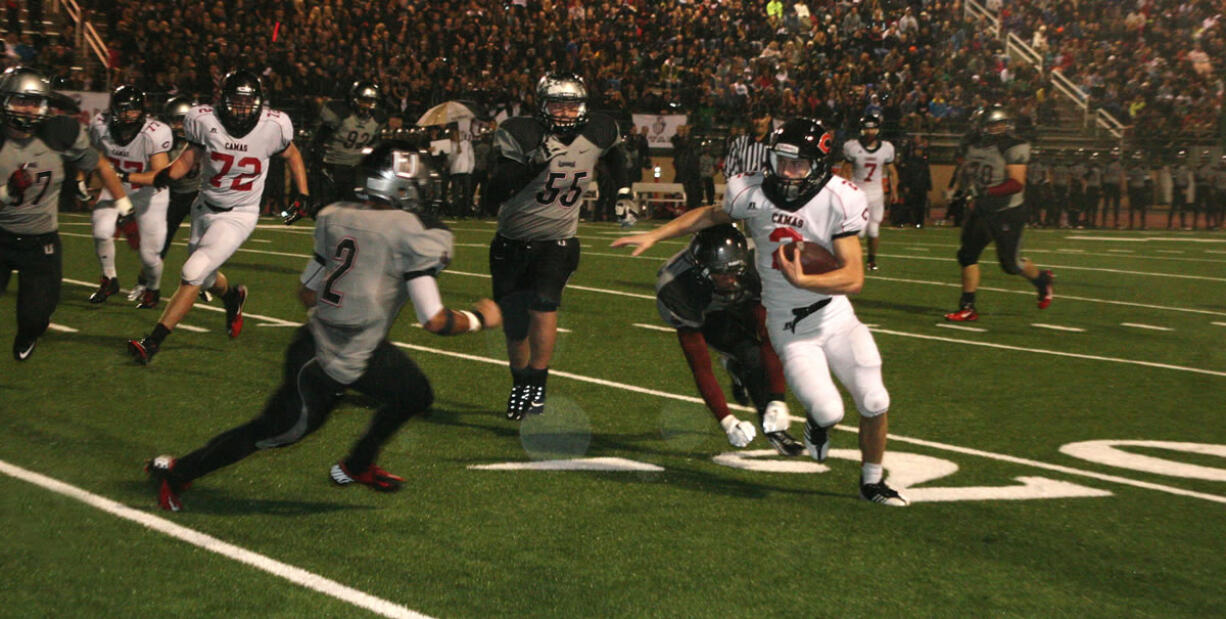 Zach Eagle weaves around the Union defenders Friday, at McKenzie Stadium.