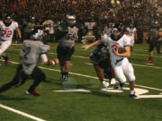 Zach Eagle weaves around the Union defenders Friday, at McKenzie Stadium.