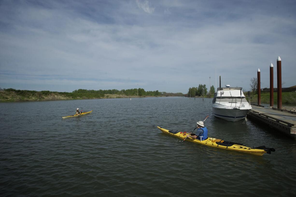 Portlanders Michele Megregian and her husband, Ryan Allen, take a paddle in April on the Lake River in Ridgefield.