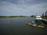 Portlanders Michele Megregian and her husband, Ryan Allen, take a paddle in April on the Lake River in Ridgefield.