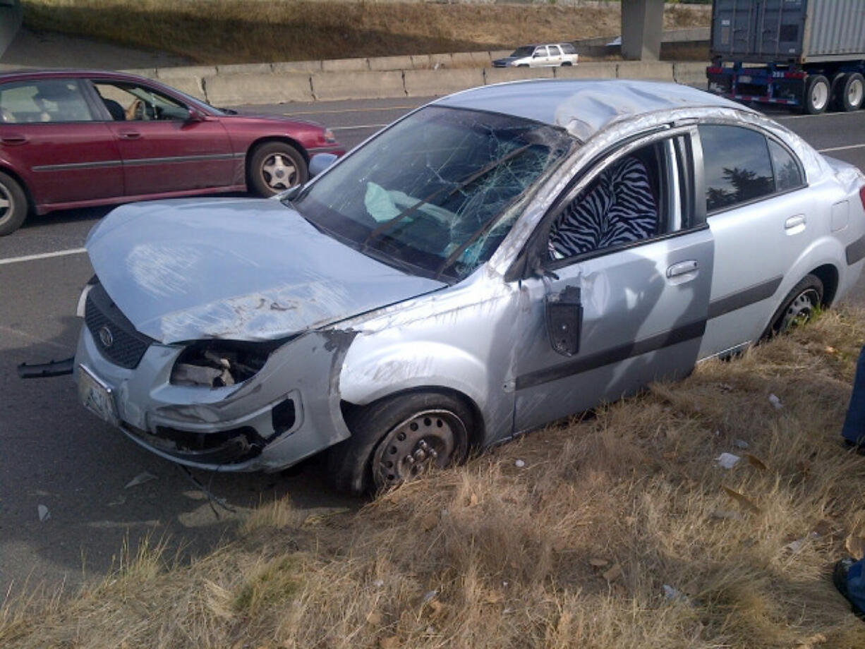 A 19-year-old Vancouver woman driving a silver Kia Rio struck a barrier along Interstate 5 Thursday afternoon, blocking traffic for 20 minutes.